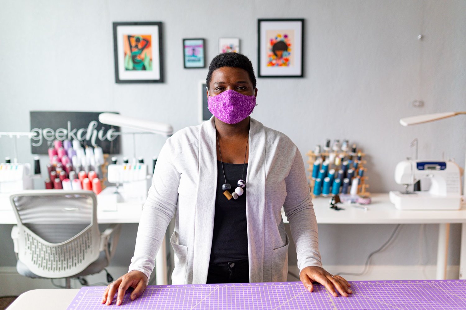 Lysandra Weber stands at her cutting table in her recently purchased studio in downtown Pittsboro. Weber is the founder and owner of Geekchicfashion, a clothing store featuring modern, comfortable and handmade designs.